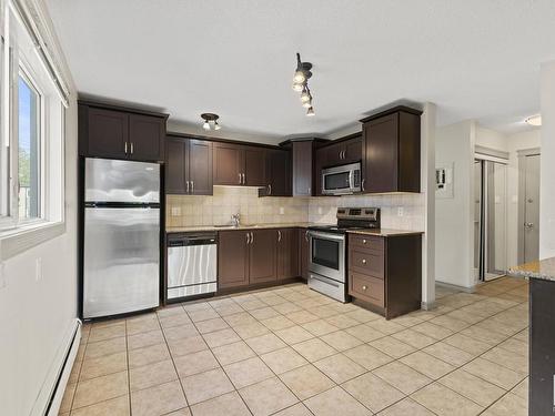 6 10710 84 Avenue, Edmonton, AB - Indoor Photo Showing Kitchen With Stainless Steel Kitchen