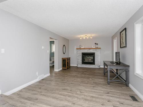 4604 43 Street, Beaumont, AB - Indoor Photo Showing Living Room With Fireplace