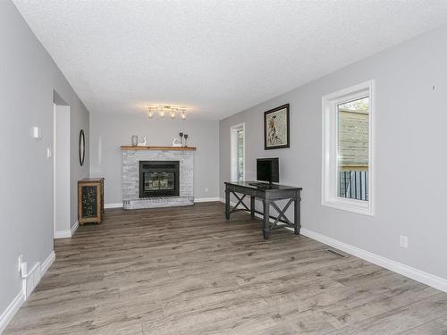 4604 43 Street, Beaumont, AB - Indoor Photo Showing Living Room With Fireplace