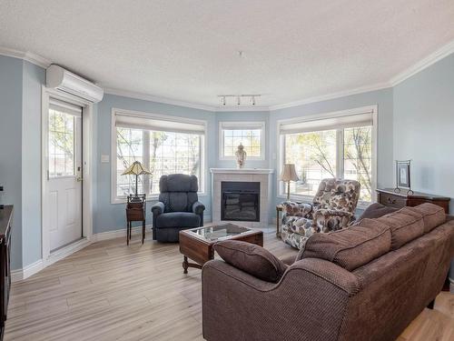 316 13450 114 Avenue, Edmonton, AB - Indoor Photo Showing Living Room With Fireplace