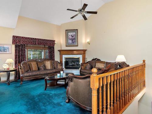 474062 A Highway 2A, Rural Wetaskiwin County, AB - Indoor Photo Showing Living Room With Fireplace