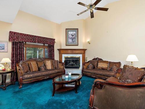 474062 A Highway 2A, Rural Wetaskiwin County, AB - Indoor Photo Showing Living Room With Fireplace