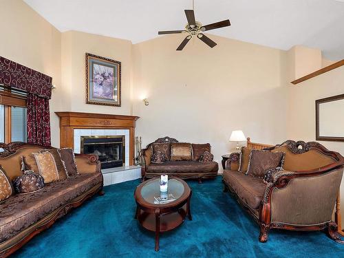 474062 A Highway 2A, Rural Wetaskiwin County, AB - Indoor Photo Showing Living Room With Fireplace