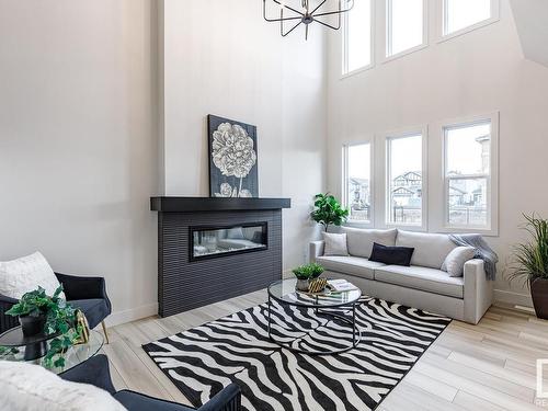 153 Rancher Road, Ardrossan, AB - Indoor Photo Showing Living Room With Fireplace