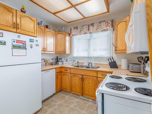 7607 128 Avenue, Edmonton, AB - Indoor Photo Showing Kitchen With Double Sink