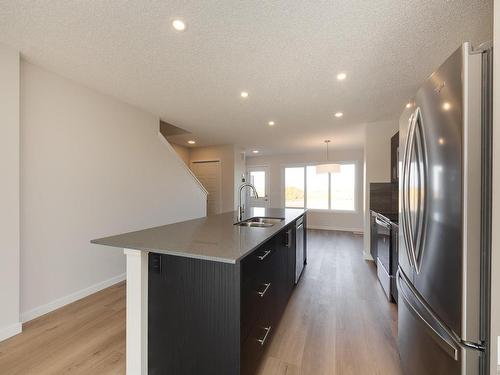 2452 Trumpeter Way, Edmonton, AB - Indoor Photo Showing Kitchen With Stainless Steel Kitchen