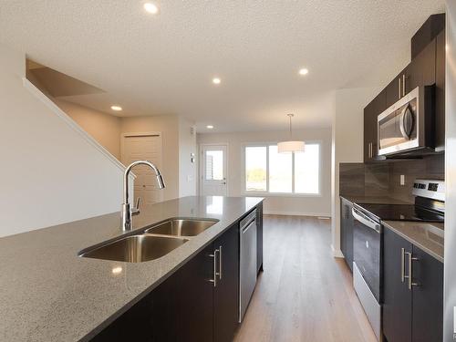 2452 Trumpeter Way, Edmonton, AB - Indoor Photo Showing Kitchen With Double Sink With Upgraded Kitchen