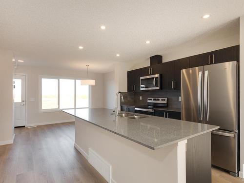 2452 Trumpeter Way, Edmonton, AB - Indoor Photo Showing Kitchen With Stainless Steel Kitchen With Double Sink With Upgraded Kitchen