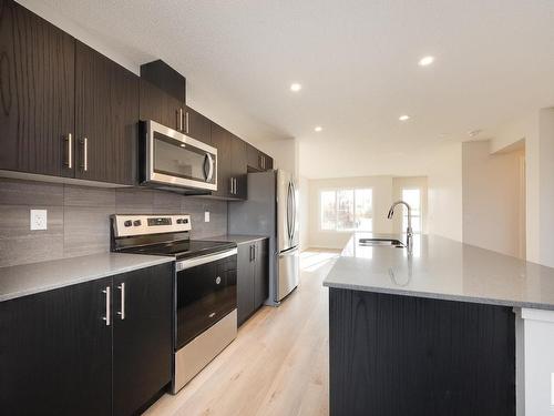 2452 Trumpeter Way, Edmonton, AB - Indoor Photo Showing Kitchen With Stainless Steel Kitchen With Upgraded Kitchen