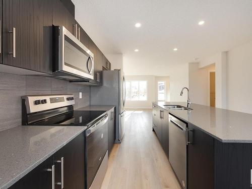 2452 Trumpeter Way, Edmonton, AB - Indoor Photo Showing Kitchen With Stainless Steel Kitchen With Double Sink With Upgraded Kitchen