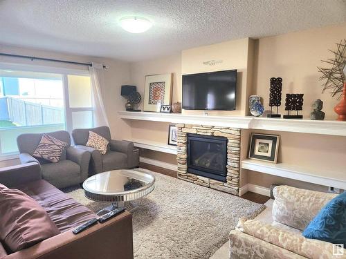 729 37A Avenue, Edmonton, AB - Indoor Photo Showing Living Room With Fireplace