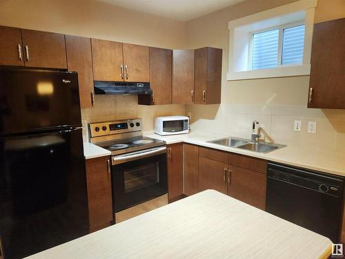 729 37A Avenue, Edmonton, AB - Indoor Photo Showing Kitchen With Double Sink