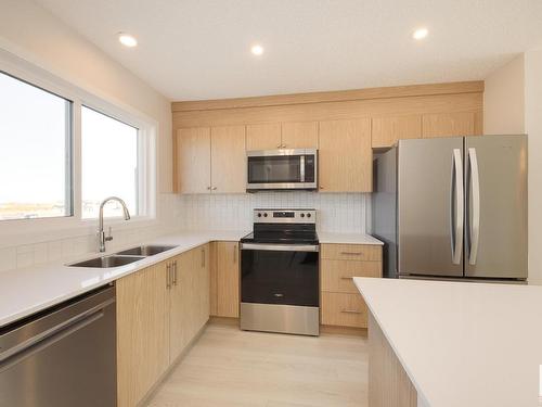 2454 Trumpeter Way, Edmonton, AB - Indoor Photo Showing Kitchen With Stainless Steel Kitchen With Double Sink