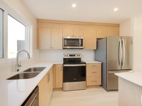 2454 Trumpeter Way, Edmonton, AB - Indoor Photo Showing Kitchen With Stainless Steel Kitchen With Double Sink