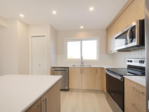 2454 Trumpeter Way, Edmonton, AB - Indoor Photo Showing Kitchen With Double Sink