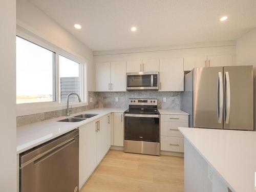 2456 Trumpeter Way, Edmonton, AB - Indoor Photo Showing Kitchen With Stainless Steel Kitchen With Double Sink