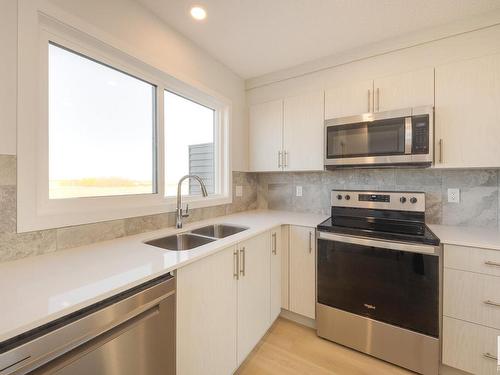 2456 Trumpeter Way, Edmonton, AB - Indoor Photo Showing Kitchen With Stainless Steel Kitchen With Double Sink