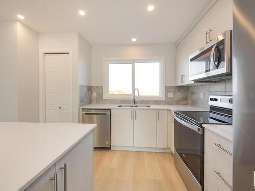 2456 Trumpeter Way, Edmonton, AB - Indoor Photo Showing Kitchen With Stainless Steel Kitchen With Double Sink