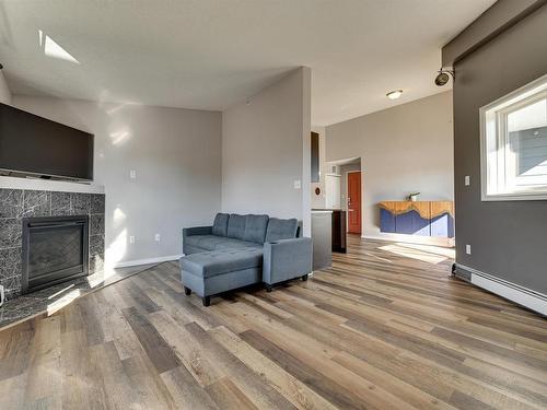 401 10710 116 Street, Edmonton, AB - Indoor Photo Showing Living Room With Fireplace