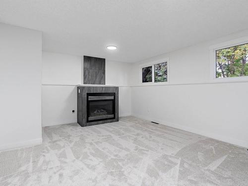 11435 46 Avenue, Edmonton, AB - Indoor Photo Showing Other Room With Fireplace