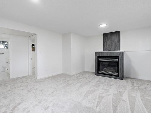 11435 46 Avenue, Edmonton, AB - Indoor Photo Showing Living Room With Fireplace