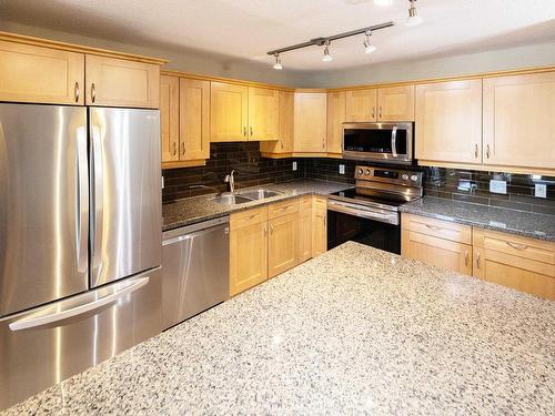 112 400 Palisades Way, Sherwood Park, AB - Indoor Photo Showing Kitchen With Stainless Steel Kitchen With Double Sink