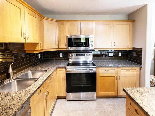 112 400 Palisades Way, Sherwood Park, AB - Indoor Photo Showing Kitchen With Double Sink