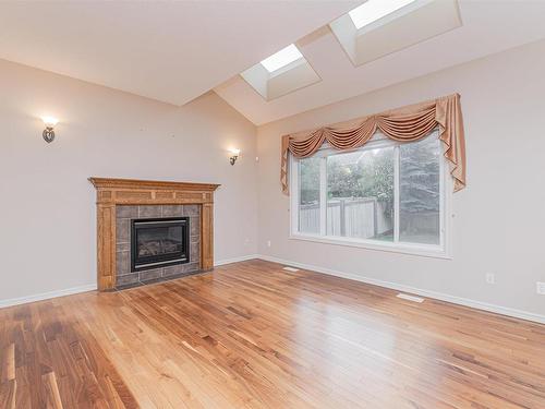 8603 11 Avenue, Edmonton, AB - Indoor Photo Showing Living Room With Fireplace