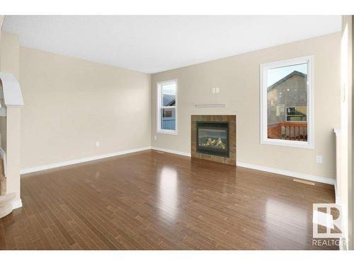 582 Tamarack Road, Edmonton, AB - Indoor Photo Showing Living Room With Fireplace