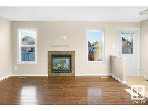 582 Tamarack Road, Edmonton, AB - Indoor Photo Showing Living Room With Fireplace