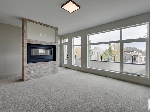 2503 Cameron Ravine Landing, Edmonton, AB - Indoor Photo Showing Living Room With Fireplace