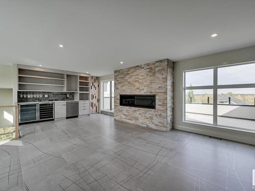 2503 Cameron Ravine Landing, Edmonton, AB - Indoor Photo Showing Living Room With Fireplace