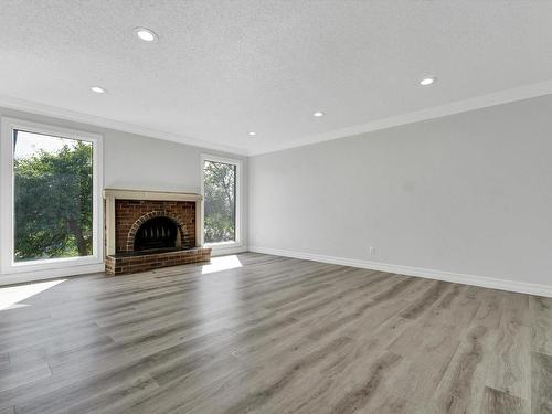 8416 26 Avenue, Edmonton, AB - Indoor Photo Showing Living Room With Fireplace