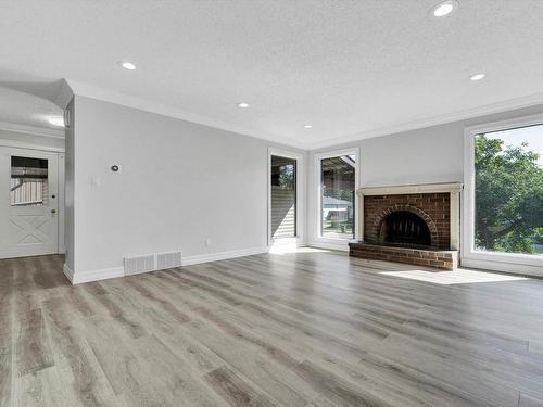 8416 26 Avenue, Edmonton, AB - Indoor Photo Showing Living Room With Fireplace