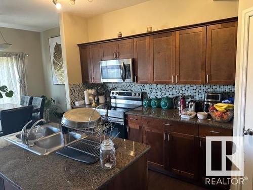 7 15151 43 Street, Edmonton, AB - Indoor Photo Showing Kitchen With Double Sink