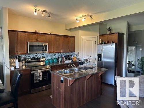 7 15151 43 Street, Edmonton, AB - Indoor Photo Showing Kitchen With Double Sink