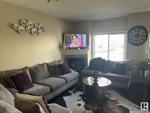 7 15151 43 Street, Edmonton, AB - Indoor Photo Showing Living Room With Fireplace