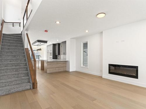 13843 110A Avenue, Edmonton, AB - Indoor Photo Showing Living Room With Fireplace