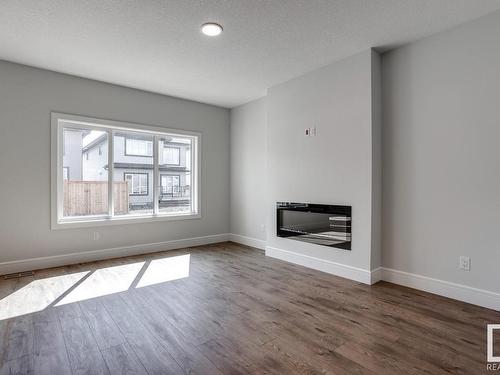 9201 102 Street, Morinville, AB - Indoor Photo Showing Living Room With Fireplace