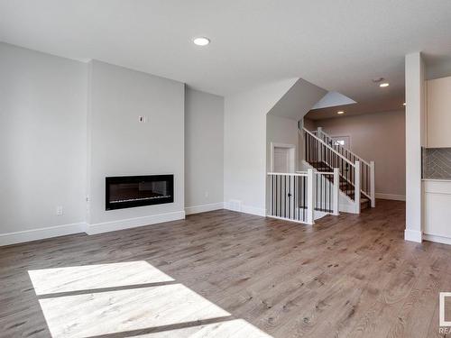 9201 102 Street, Morinville, AB - Indoor Photo Showing Living Room With Fireplace