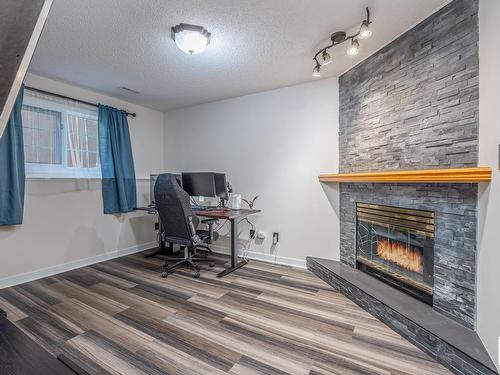 6 15 Poirier Avenue, St. Albert, AB - Indoor With Fireplace