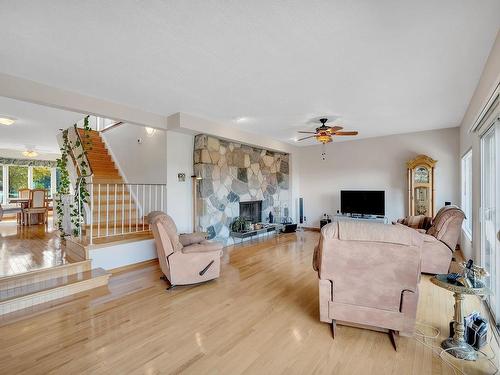 208 Grandisle Point(E) Nw, Edmonton, AB - Indoor Photo Showing Living Room With Fireplace