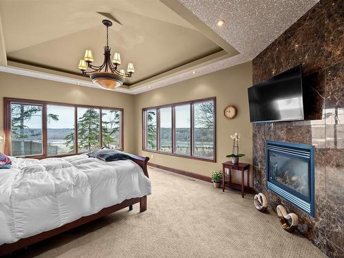 188 Windermere Drive, Edmonton, AB - Indoor Photo Showing Bedroom With Fireplace