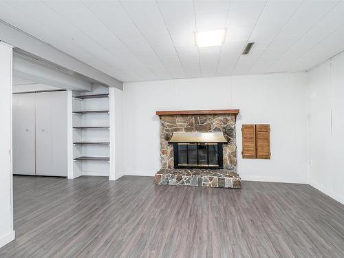 11616 39A Avenue, Edmonton, AB - Indoor Photo Showing Living Room With Fireplace