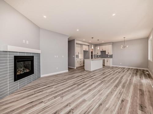 10238 92A Avenue, Morinville, AB - Indoor Photo Showing Living Room With Fireplace