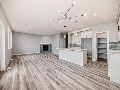 10238 92A Avenue, Morinville, AB - Indoor Photo Showing Kitchen With Fireplace