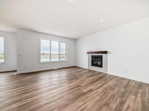 10226 92A Avenue, Morinville, AB - Indoor Photo Showing Living Room With Fireplace