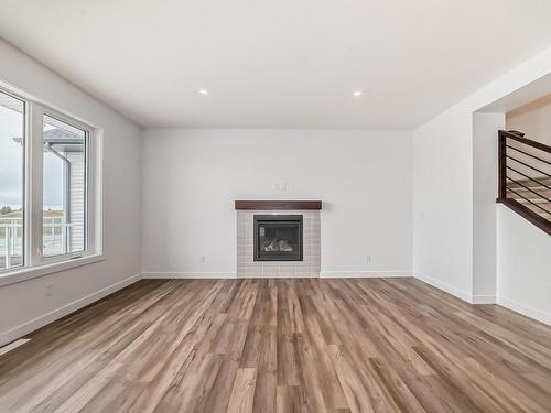 10226 92A Avenue, Morinville, AB - Indoor Photo Showing Living Room With Fireplace