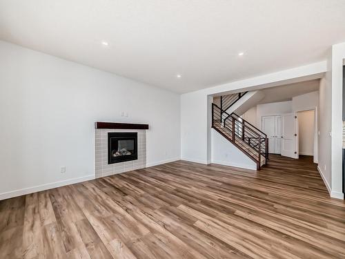 10226 92A Avenue, Morinville, AB - Indoor Photo Showing Living Room With Fireplace