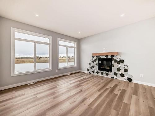 10214 92A Avenue, Morinville, AB - Indoor Photo Showing Living Room With Fireplace